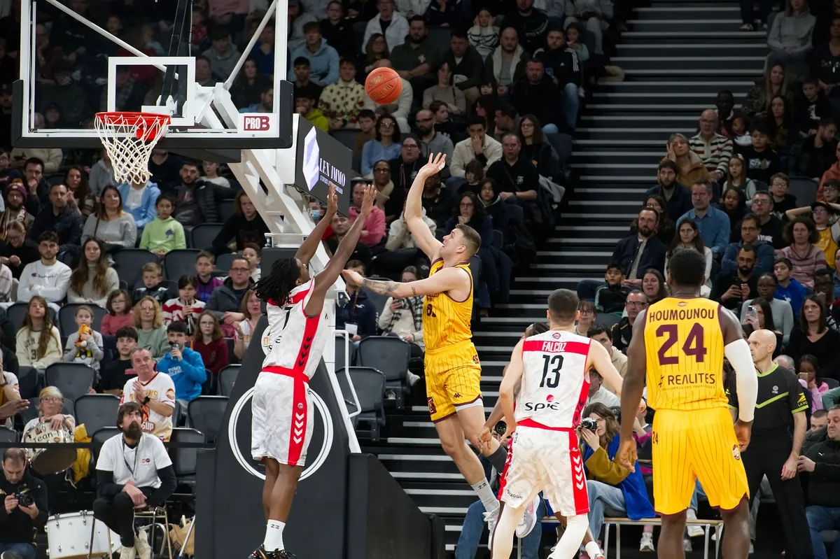 Silhouette of a basketball player in action on a professional court during a game
