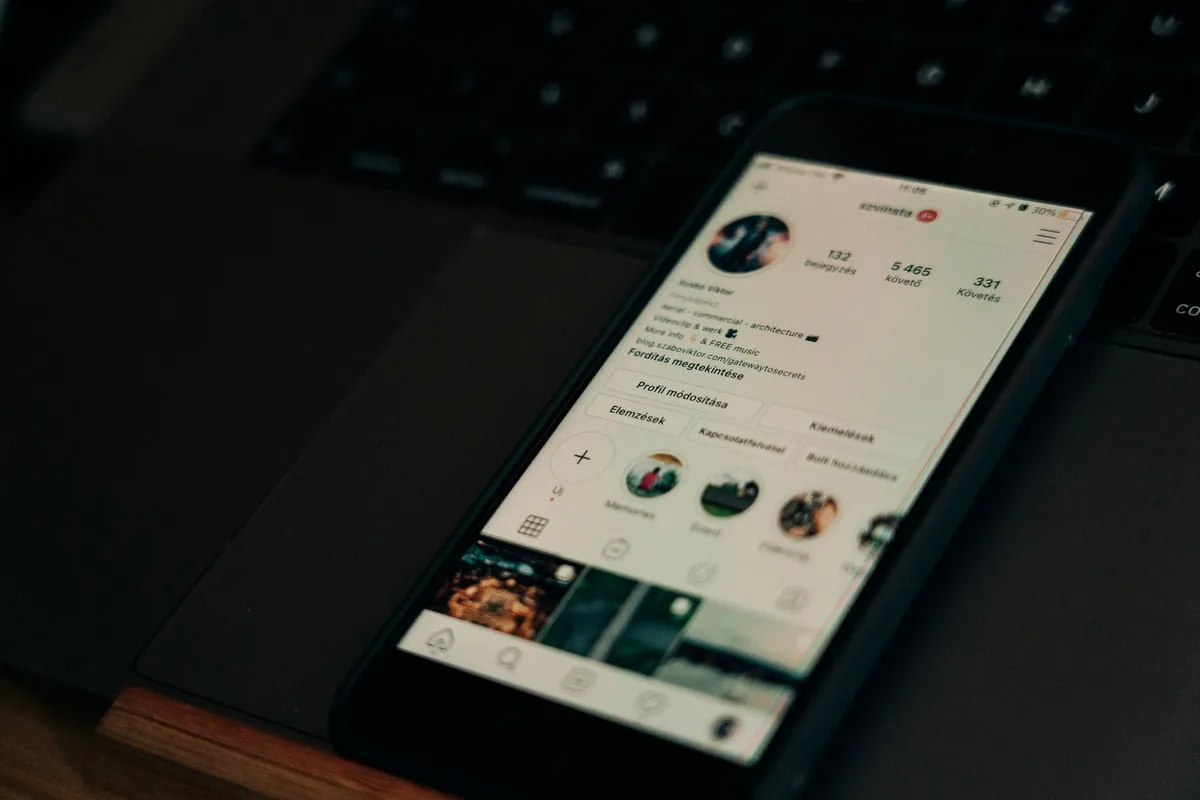 Smartphone screen showing a suspicious fake social media profile with generic profile picture and messaging interface