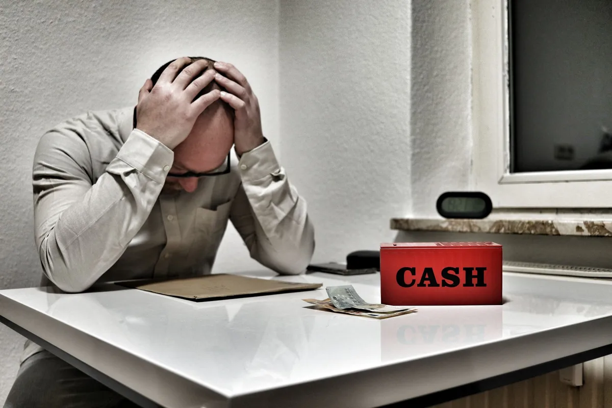 Campus worker at desk reviewing finances and bills