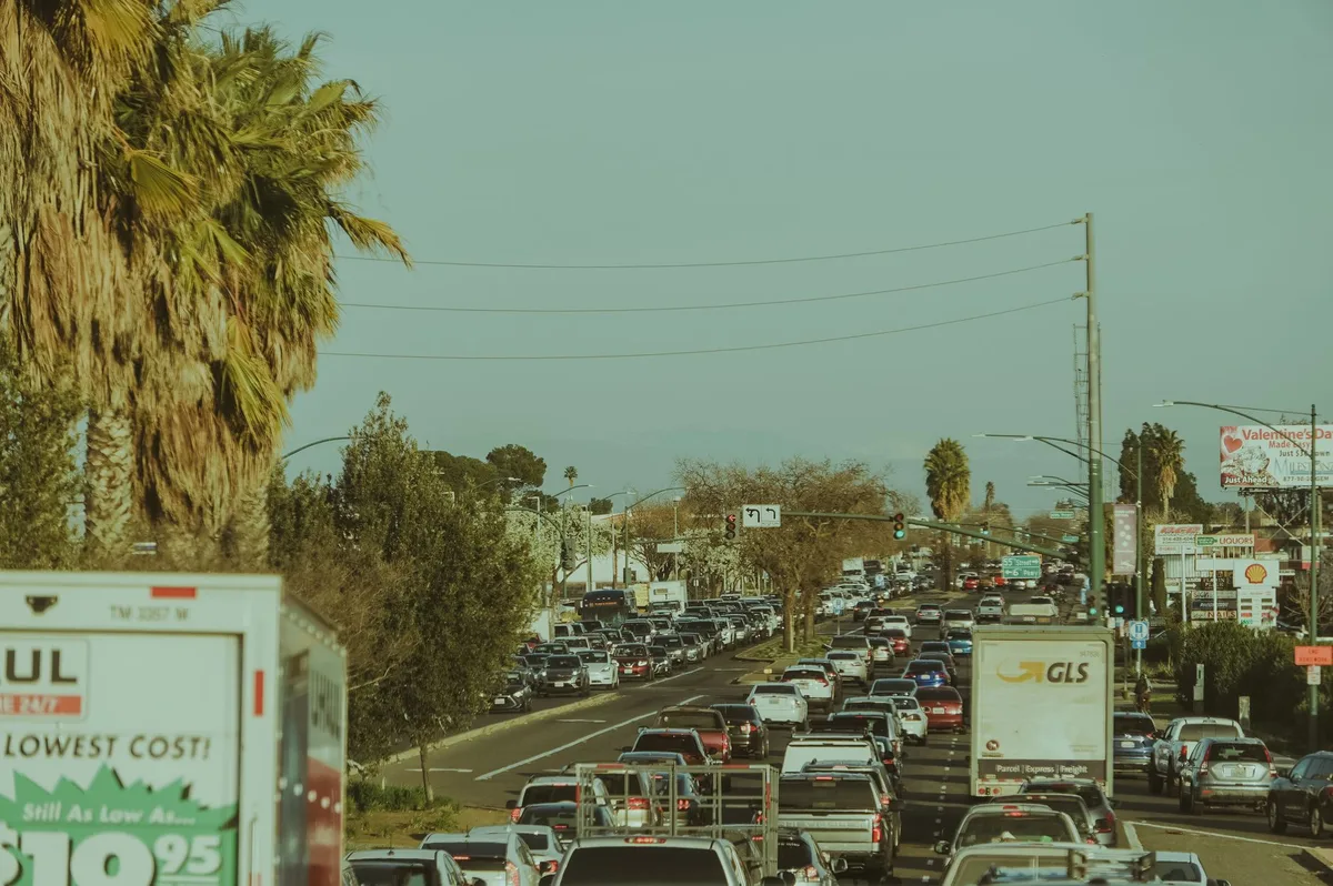 Congested suburban intersection with multiple vehicles during peak traffic hours