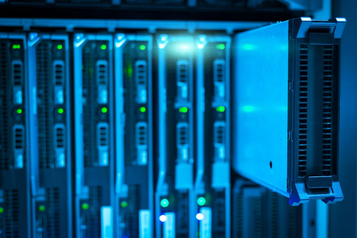 Large data center facility with rows of server equipment and computing infrastructure