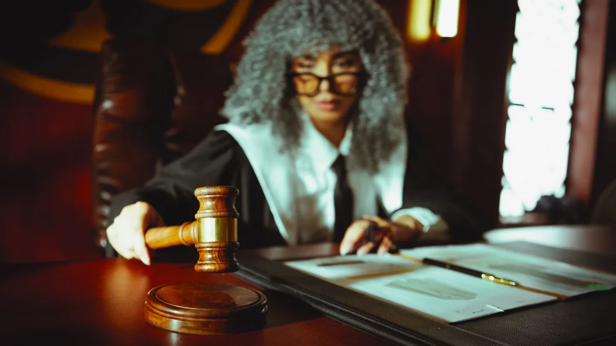 Gavel and legal documents on a judge's desk during a sentencing hearing