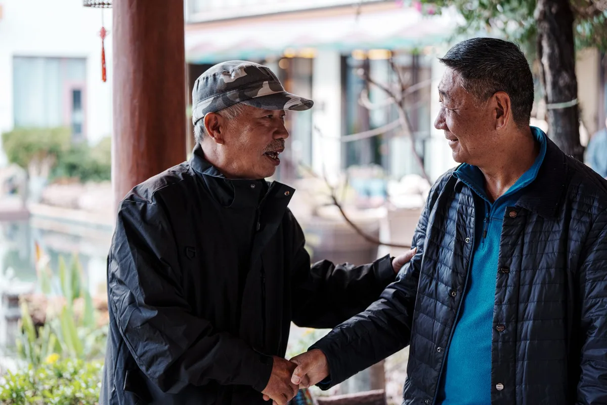 Two people engaged in conversation, demonstrating the social connection that hearing care enables