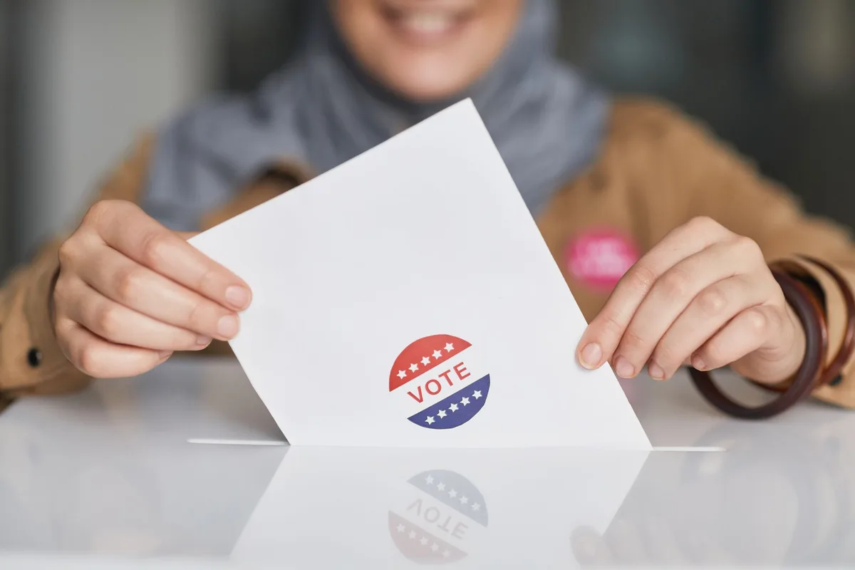 Voter completing a local ballot at a polling place
