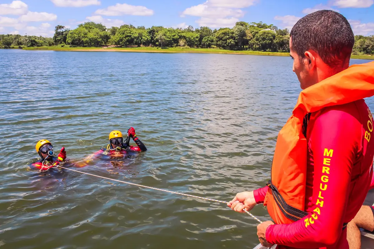 Trained rescue divers preparing equipment for underwater search operations