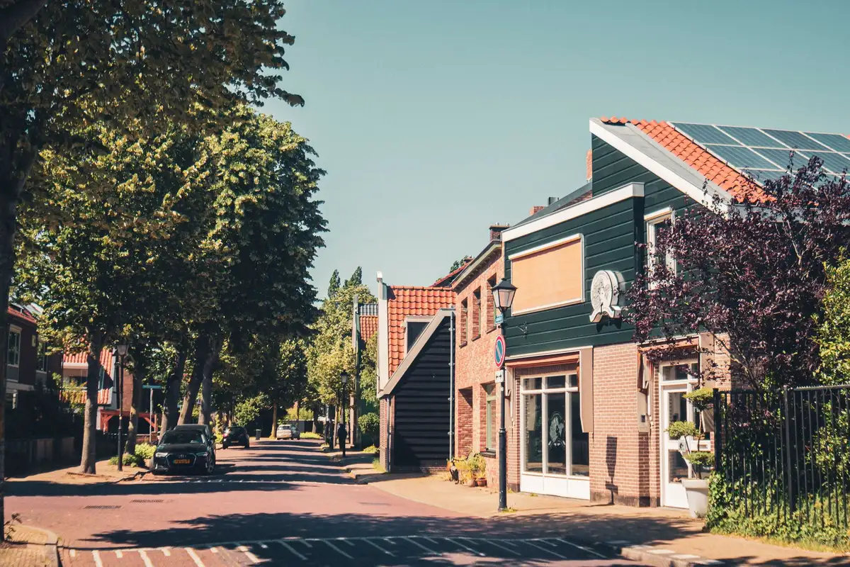 Clean, well-maintained urban street with landscaping, improved storefronts and clear wayfinding signage