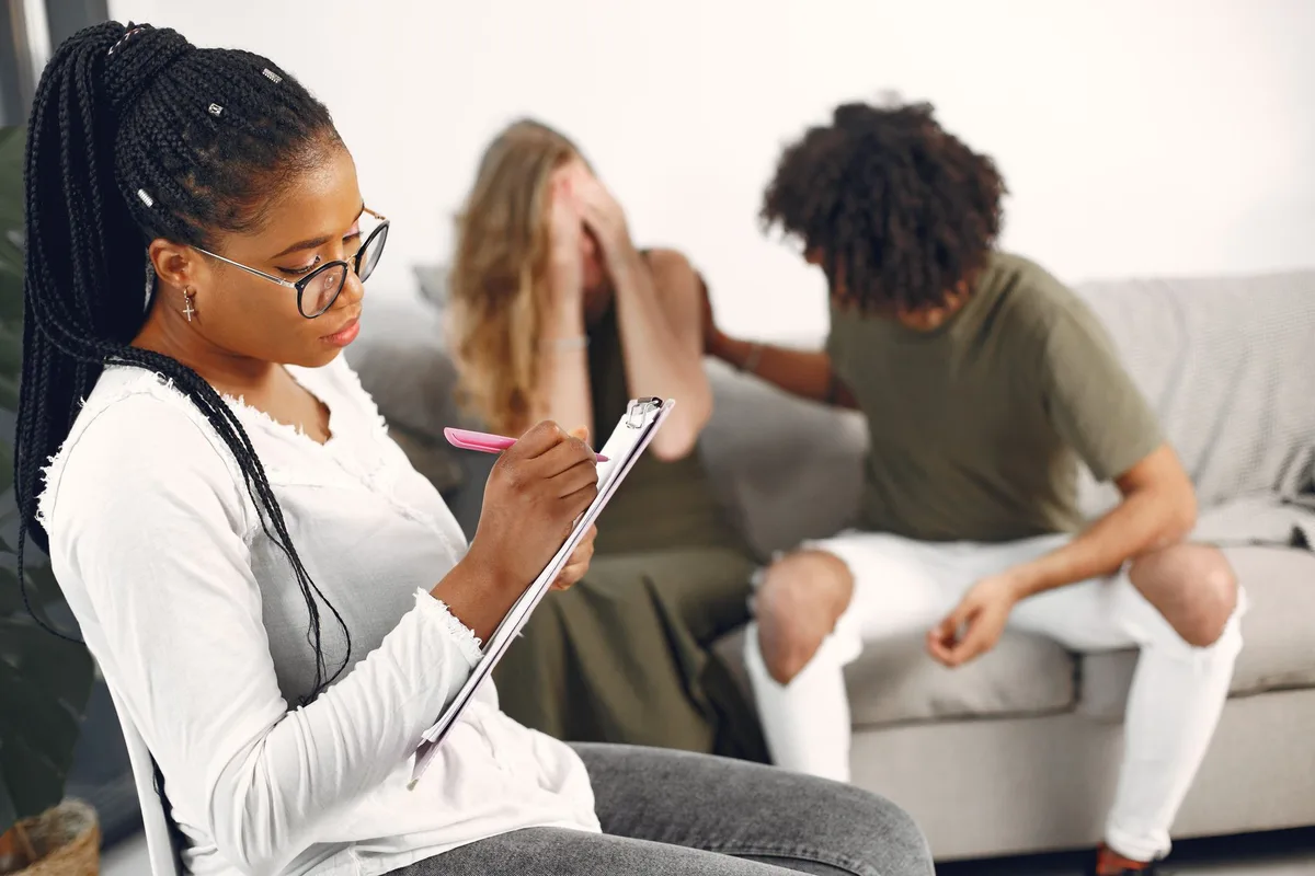 Compassionate support session showing hands-on counseling assistance in a safe environment