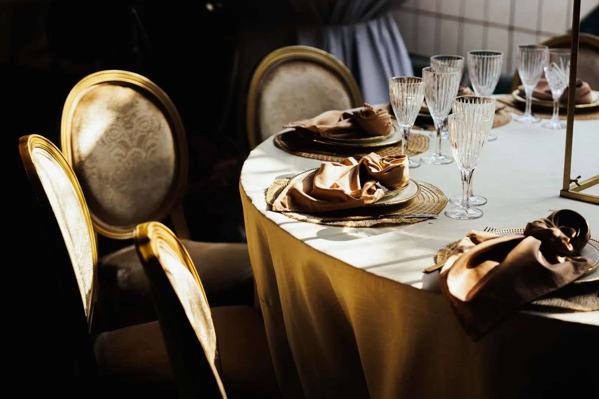 Elegant gala attendees in formal attire at an upscale fundraising event
