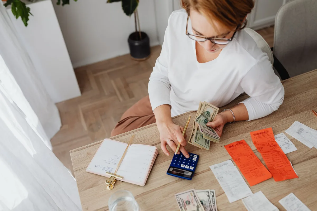 Older adult budgeting household expenses and bills