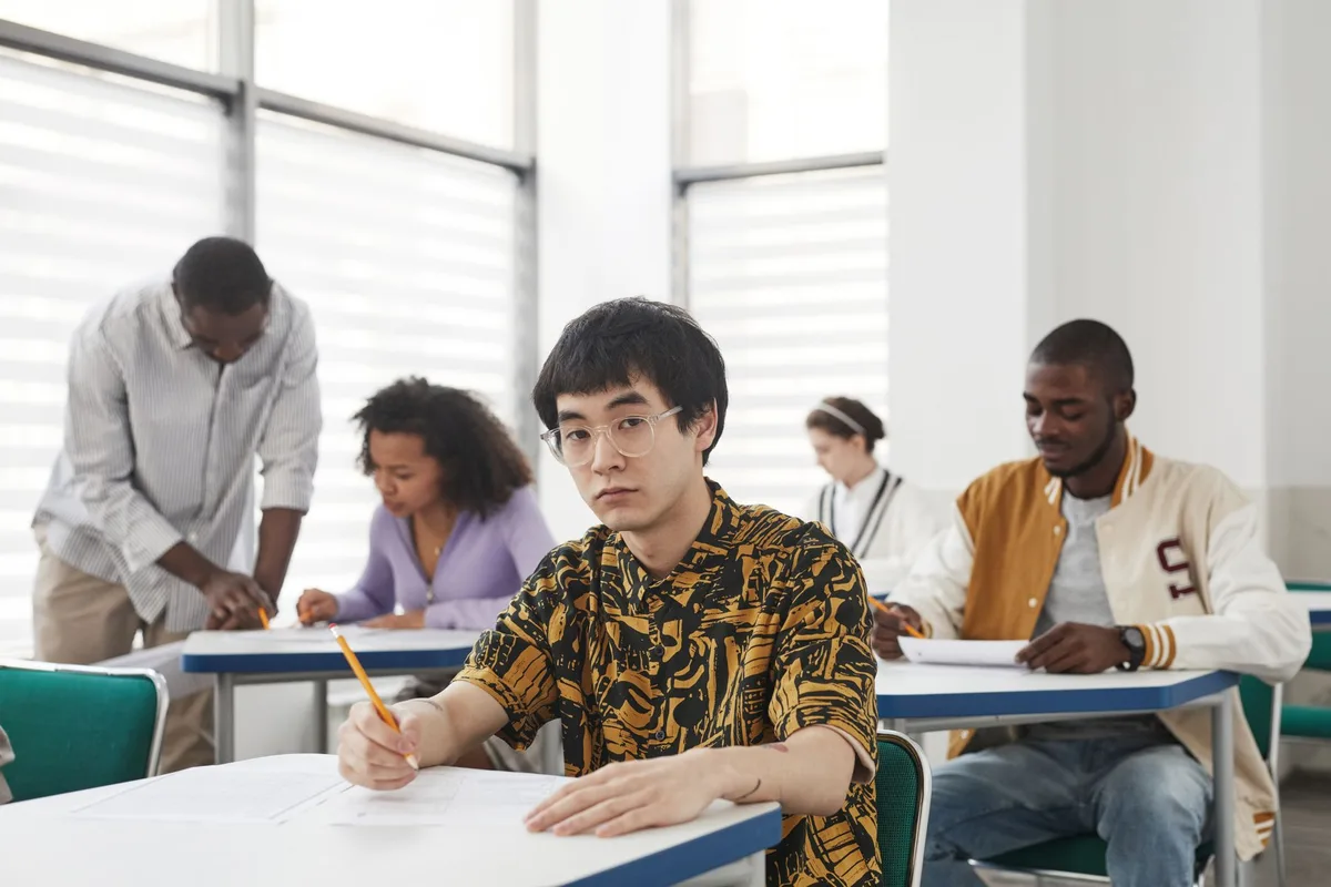 Undergraduates working on assignments in a classroom setting
