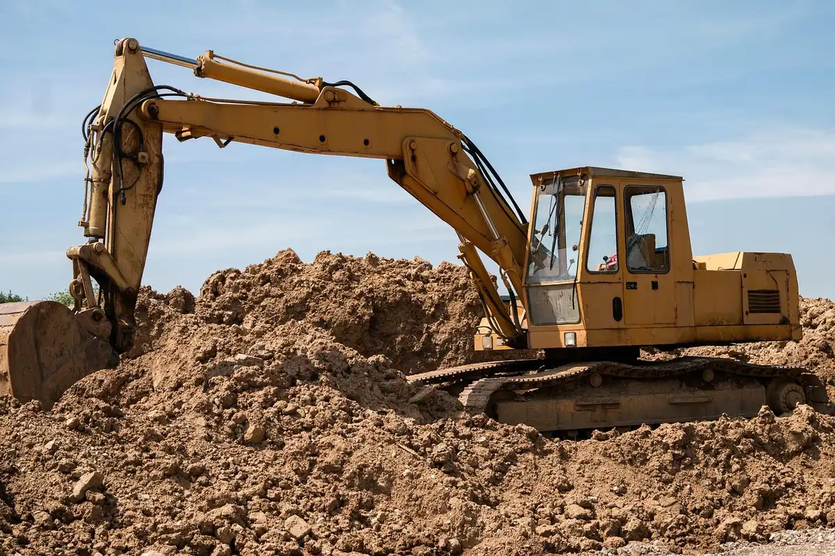 Construction site of a commercial campus with heavy equipment and cleared lots