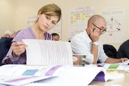 Worker reviewing job listings and career development options on a digital device