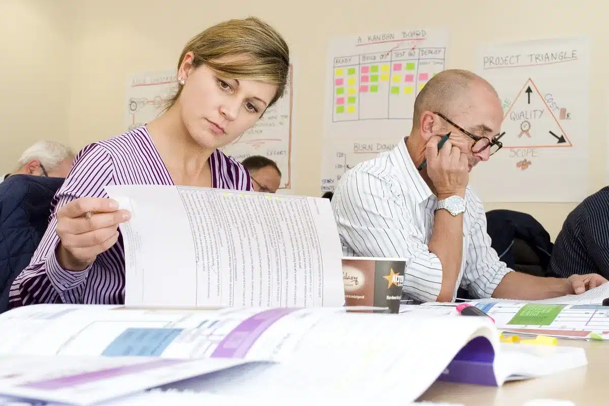 Worker reviewing job listings and career development options on a digital device