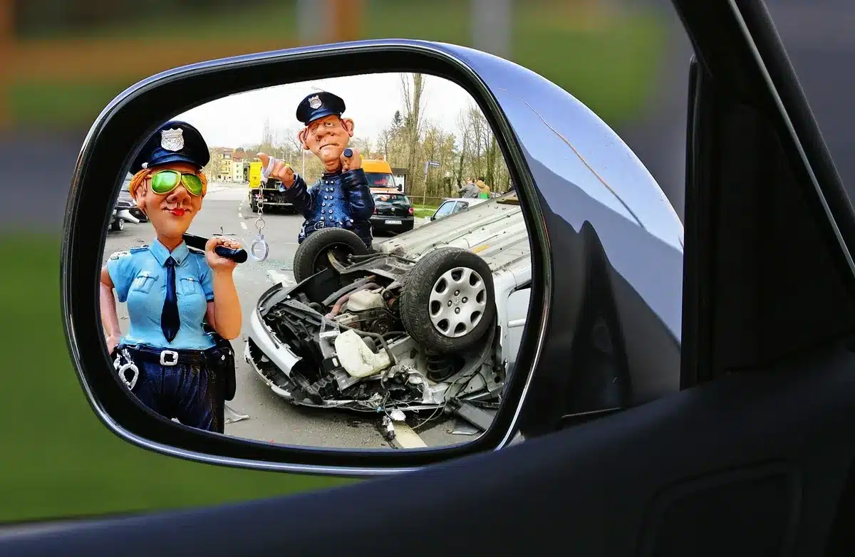 Uniformed officers directing vehicles and pedestrians at a campus intersection