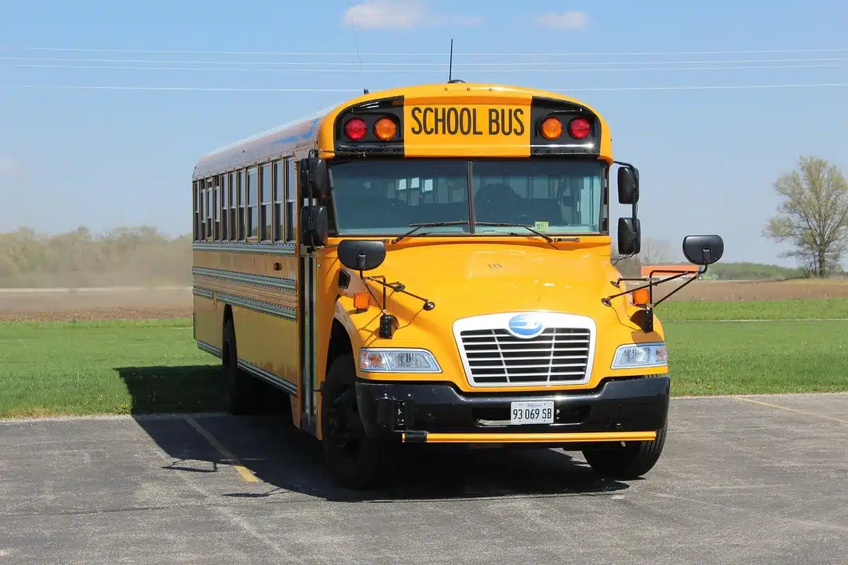 Shuttle bus transporting festival attendees from parking area