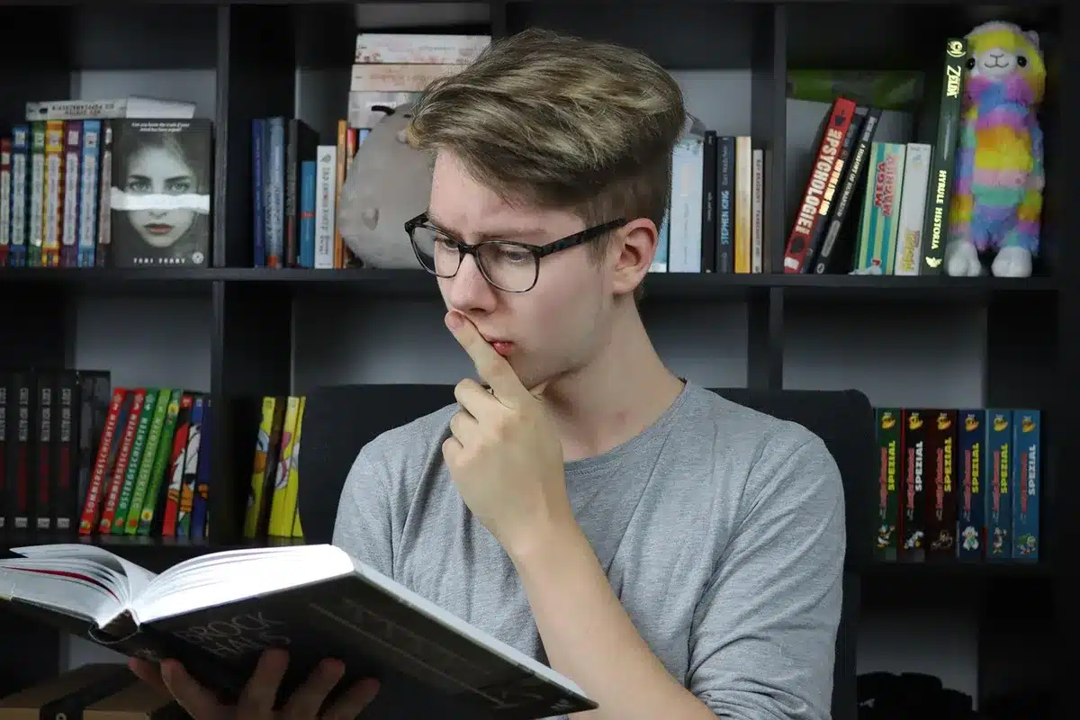 Student concentrated on fluid mechanics or engineering coursework at a desk