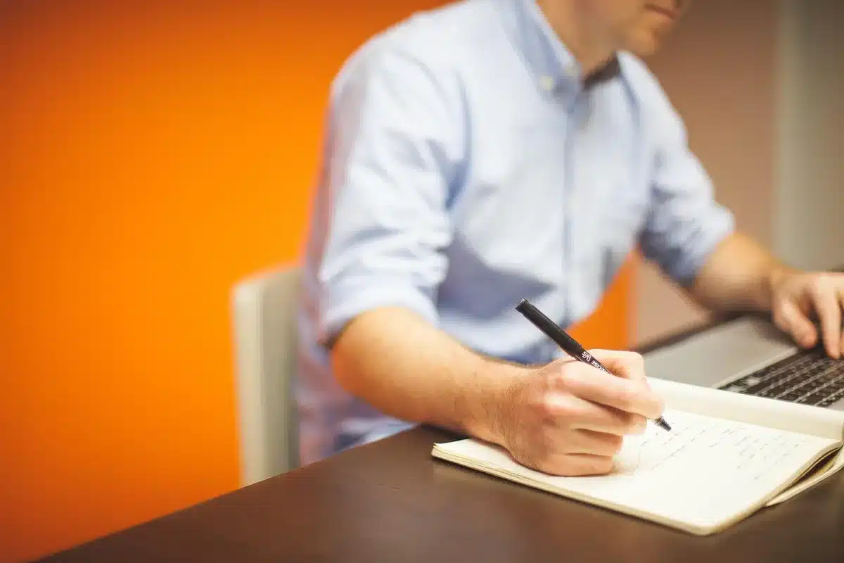 Printed memorandum of understanding on a meeting table with hands