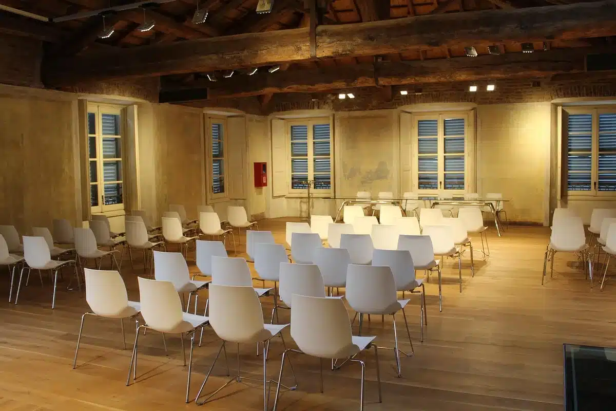 Community meeting room with survey forms on a table in daylight