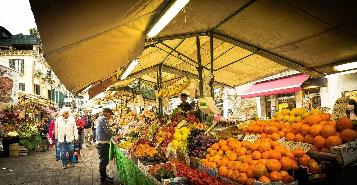 Outdoor stage with musicians and vendor booths in a sunny market