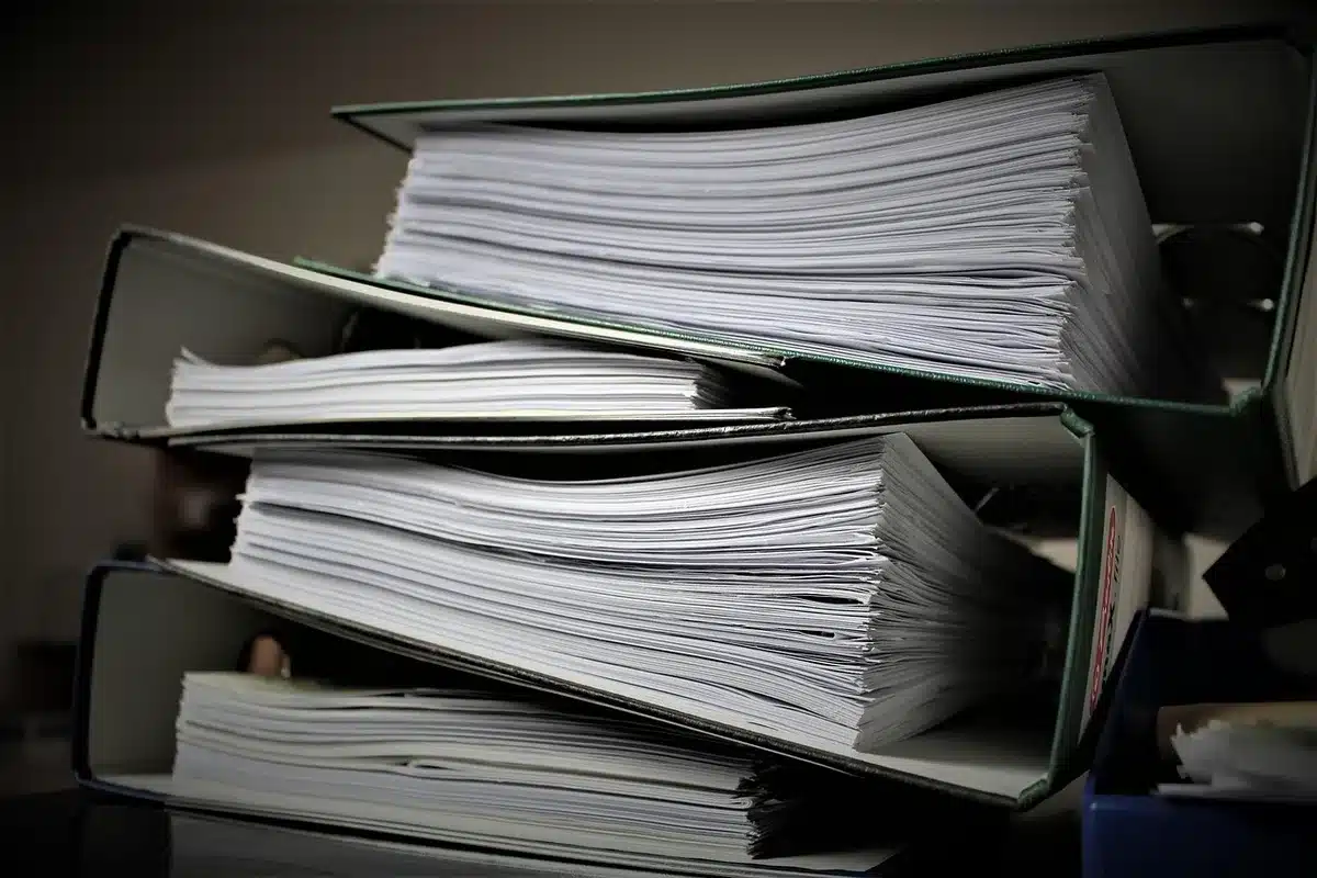 Folder labeled 'case' and courthouse documents on a table