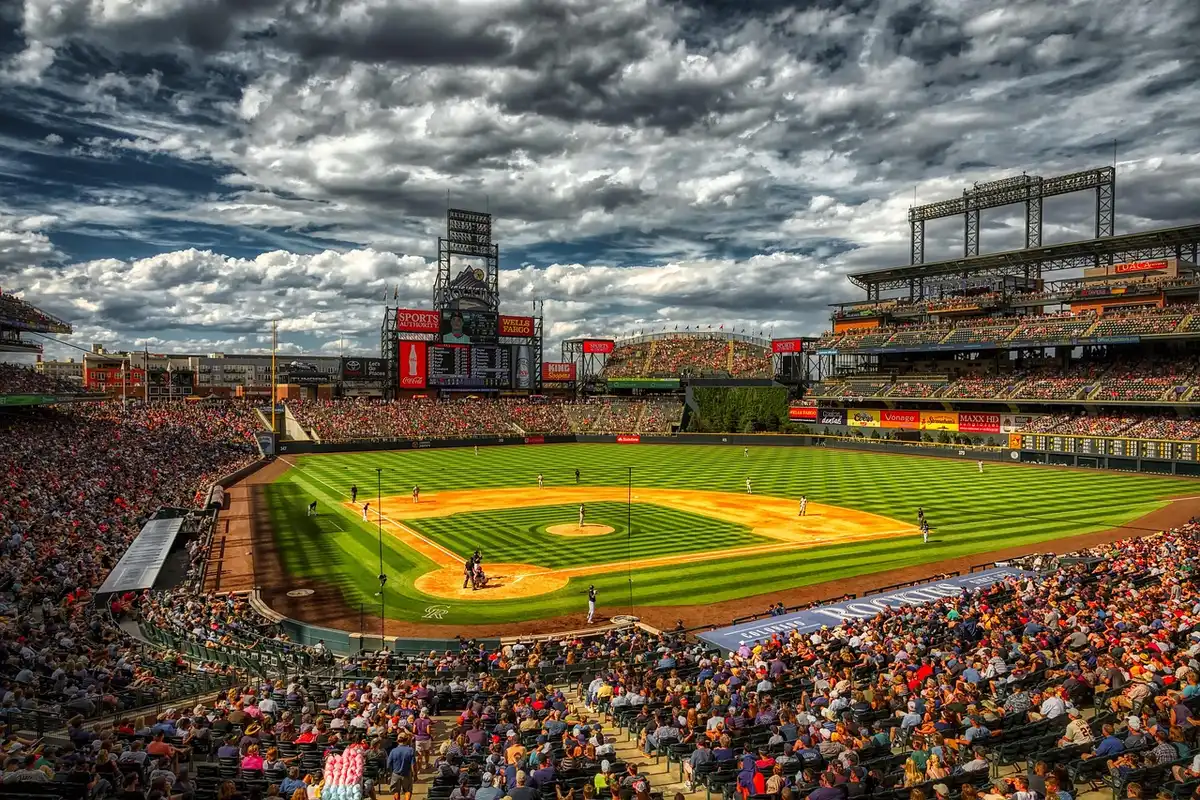 Players and fans at a daytime high school baseball championship game